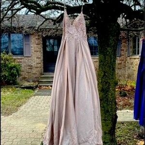 Prom dress. Size 4 with a corset back. It is a soft pink, Shimmers so pretty!